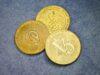 Тестирование Криптопроектов — Заработок для Технических Специалистов three gold coins sitting on top of a blue surface