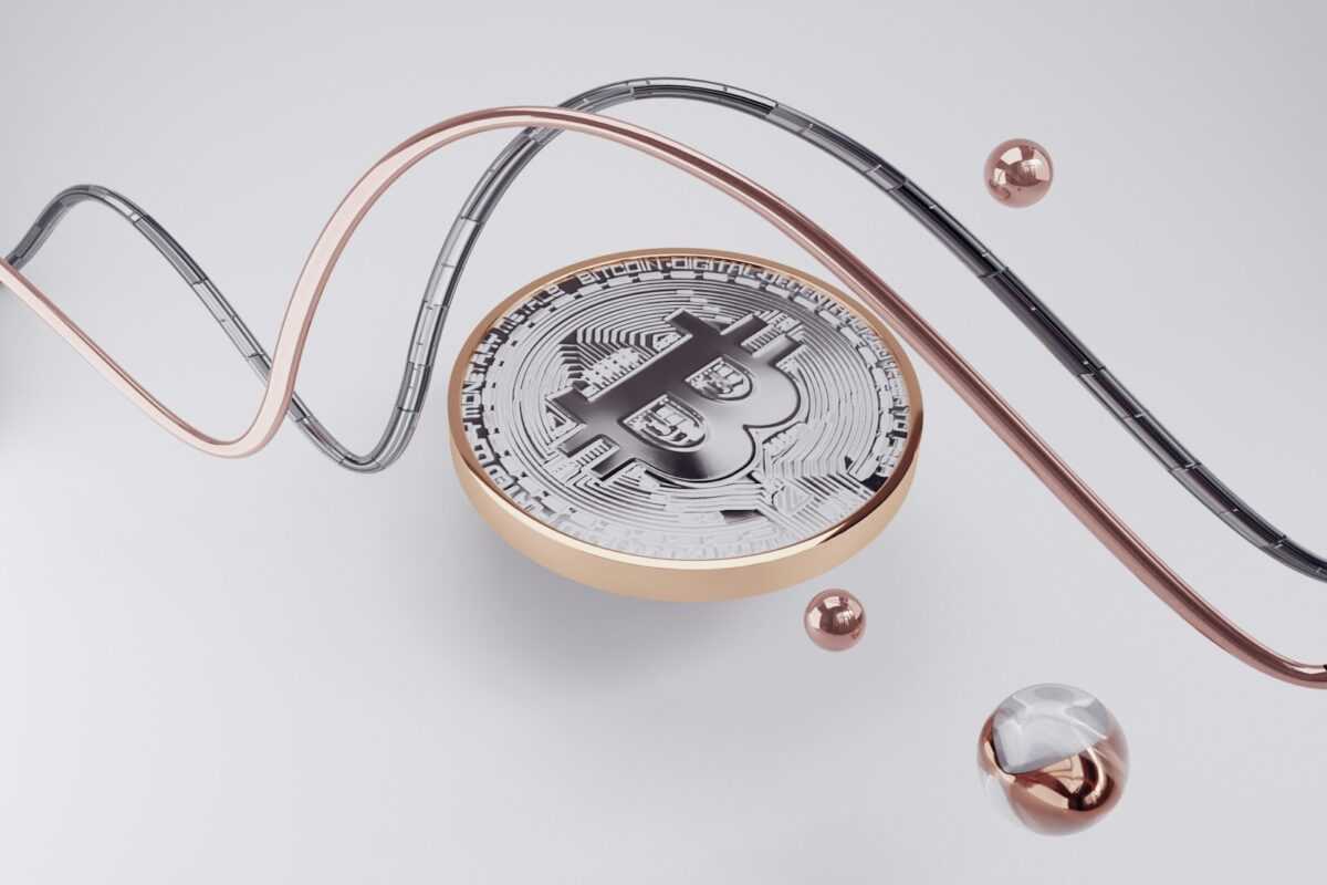 a compass with a bitcoin on top of it